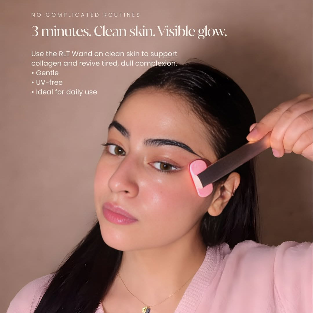 Skincare wand being applied to cheek area